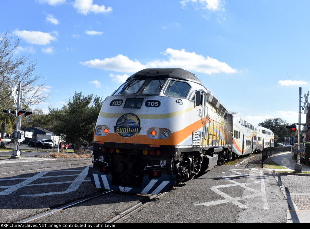 The Sunrail train heads away from WPK station toward its next stop of AventHealth 